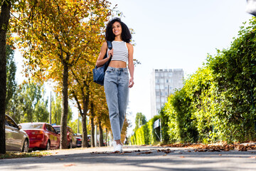 Photo of adorable lovely cute girl dressed stylish clothes walking alone in city center exploring small european town