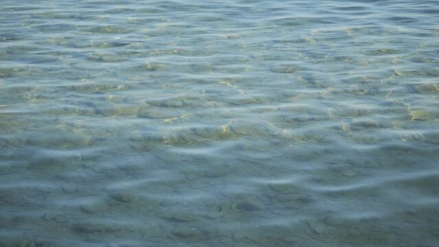  Perpetual undulating ripples of alluring crystal clear freshwater lake 
