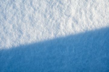 Obraz premium Abstract overhead view of snow with a diagonal separating the shadows, Brussels, Belgium