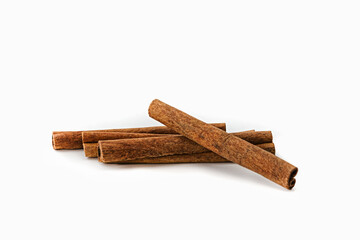 Four cinnamon sticks on a white background. Isolated