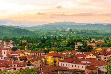 travel summer view from hill to a nice european town with amazing buildings, green hills and...