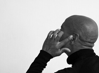 deafness suffering from hearing loss on grey white background with people stock image stock photo	