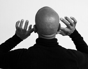 deafness suffering from hearing loss on grey white background with people stock image stock photo	