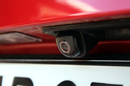 Rear view camera on trunk car. Modern car rear view camera close up for parking assistance. Assist device equipment in modern cars. Concept of safety car driving while parking process. 