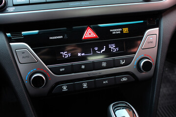 Car climate control. Turning on the air conditioning of a car on the climate control panel. Car...