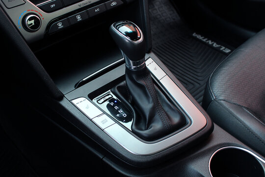 Vinnytsia, Ukraine; February 11, 2024. Hyundai Elantra Automatic transmission gear knob. Modern leather interior of the new car. Gear stick with multimedia console. Button for shifting gears on car.