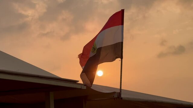 Egyptian flag, sundown, sun and sky