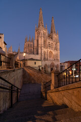 Fototapeta na wymiar Gothic cathedral facade of the city of Burgos at night in a suuny day. Castilla y Leon, Spain.