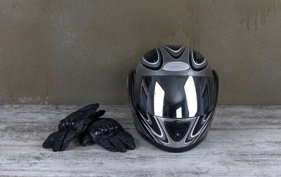 motorcycle helmet and biker gloves on the table