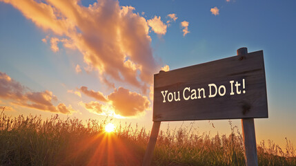 Motivational poster with the text "You Can Do It!", against a backdrop of a sunrise symbolizing new beginnings and opportunities