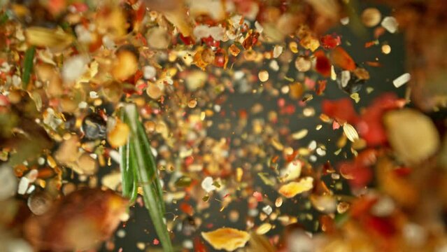 Super Slow Motion of Falling and Rotating Spices Mix. Filmed on High Speed Cinema Camera, 1000 fps.