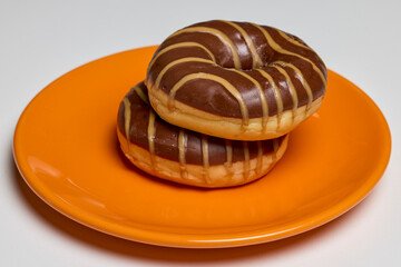 donut with chocolate glaze filled with caramel.