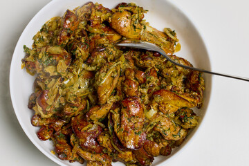 chicken livers cooked in the oven with onions, dill, salt and pepper ready to eat.
