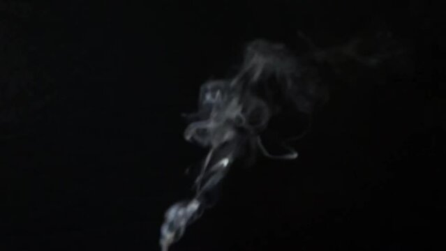 Fog haze on dark background. Realistic atmospheric gray smoke cloud. High quality 4k footage