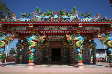 Fototapeta premium Chinese temple near Udon Thani city, Thailand. Religious traditional national architecture. Beautiful landmark, architectural monument