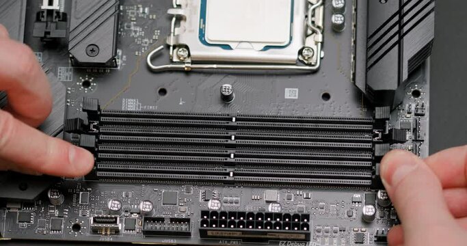 Installing two RAM modules into the motherboard slots. Assembling a personal computer