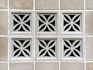 The house's partition walls are decorated with cement grilles and square geometric shapes to facilitate ventilation and maintain air circulation. Cement wall decoration, square cement basket empty