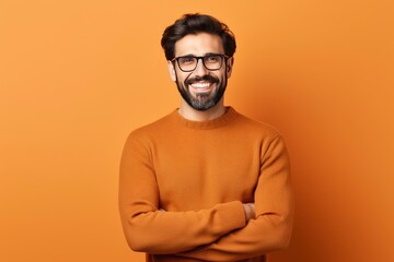 Young handsome man with beard wearing casual sweater and glasses over one color background, happy face smiling with crossed arms looking at the camera. Positive person - generative ai