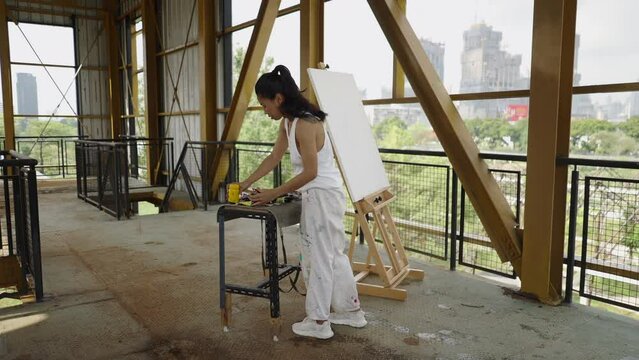 Asian girl with her painting tools 