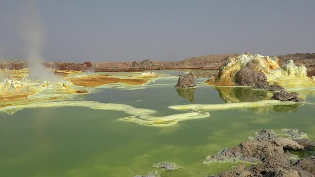 Beauty in nature. Acid lake in the crater of Dallol volcano in the Ethiopian desert. Travel Ethiopia. Lake Dallol with its sulphur springs. Danakil depression desert. Africa. Unique place.