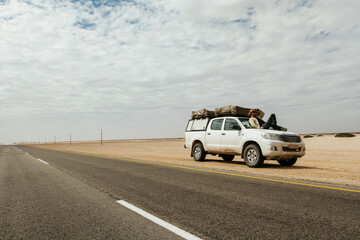 Man tourist with car in the deserts of Africa, Namibia