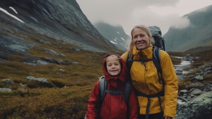 Mother and daughter hikers having fun in Norway mountains travel together active healthy lifestyle family vacations woman playing with child Mother's