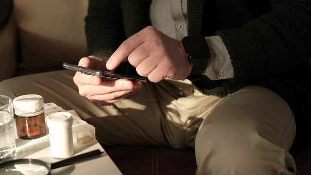 Man using pharmacy mobile app to refill prescription, 4k
