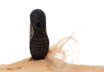 Unemployed Tired or stressed businessman kicking sand ground on walkway after work stressed. Back shoe foot step hit sand dust splashing over white background isolated