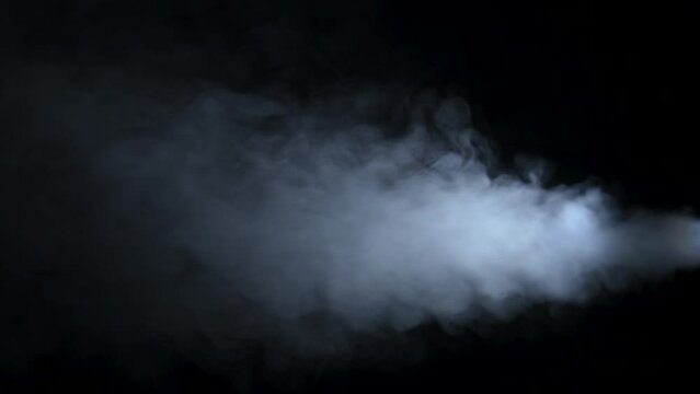Car exhaust gases from an exhaust pipe on a black background. White smoke. Environmental pollution concept.