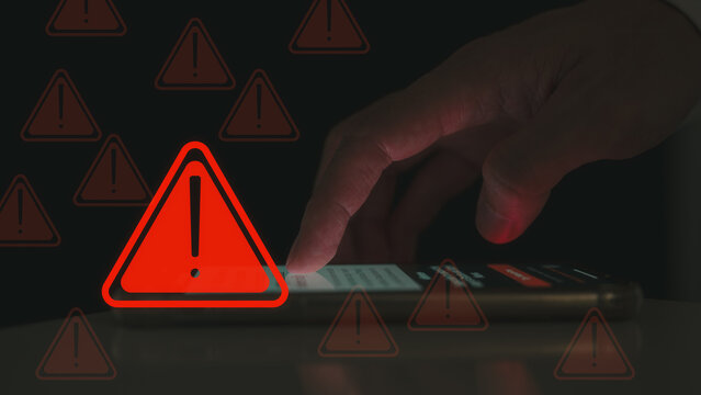 risk and notification error and maintenance concept, user using smartphone with triangle caution warning sign, hacker attacks and hacking data, cyber crime, cyber security, Ransomware, Phishing