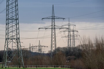 high-voltage pylons  in german industrial landscape