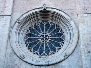 detail of the rose window of Medieval Cathedral of San Vigilio Dome Gothic style, Trento , Italy