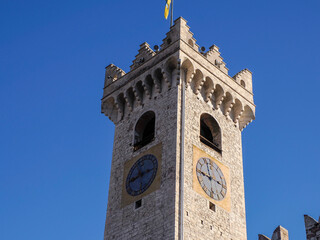 the clock tower of Medieval Cathedral of San Vigilio Dome Gothic style, Trento , Italy