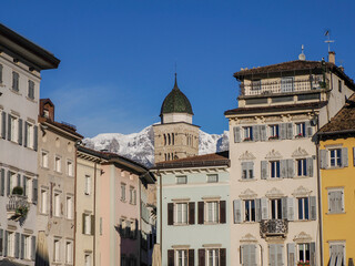 Fototapeta na wymiar Church of Santa Maria Maggiore, Trento, Italy view from dome place with snowy dolomites mountains background
