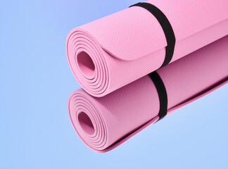 Pink sports mat for yoga and other fitness activities. Copy space for text.