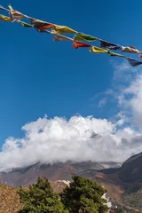 Photo sur Plexiglas Ama Dablam View of Ama Dablam mountain in clouds during trekking in Nepal. EBC Everest Base Camp or Three passes trek in Nepal. Mountain range Himalayas in Pangboche village, the Khumbu region of Nepal, Asia.