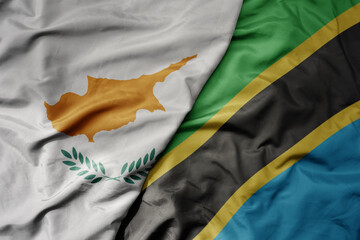 big waving national colorful flag of tanzania and national flag of cyprus.