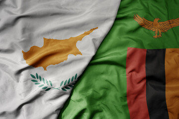 big waving national colorful flag of zambia and national flag of cyprus.