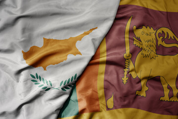 big waving national colorful flag of sri lanka and national flag of cyprus.