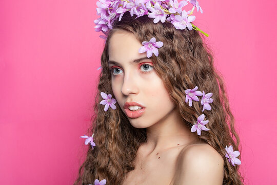 Beautiful girl with flowers in in hair