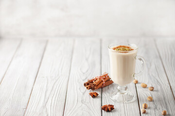 Turkish traditional hot drink salep on white wooden background. Copy space