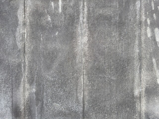Weathered Concrete Wall with Streaked Patterns.