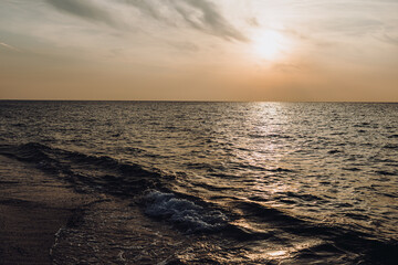 beautiful evening landscape on the sea. sunset of the setting sun. the sun disappeared behind the...