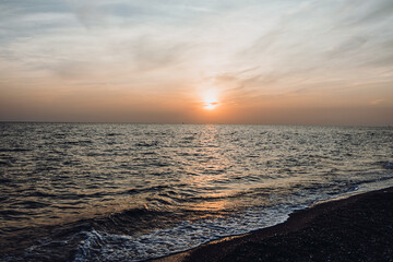 Obraz premium beautiful evening landscape on the sea. sunset of the setting sun. the sun disappeared behind the horizon of the sea.Turkey Mediterranean Sea