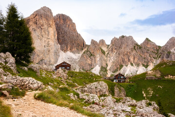 Fototapeta na wymiar Wooden mountain refuge in Dolomite alps, Italy in summer