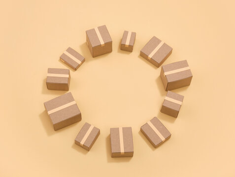 Taped cardboard boxes in the shape of a circle. Copy space for text.