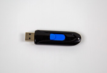A USB flash drive for a laptop computer is isolated on a white background. Computer repair telephony modern technologies.