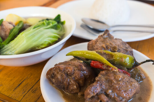 Adobong Manok sa Gata and Nilagang Baka Soup served with rice.