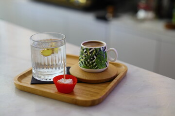 Traditional Turkish coffee with cold water and Turkish delight in cafe. Selective focus - Image