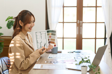 Architecture concept, Female architect presenting house interior design to client on video call